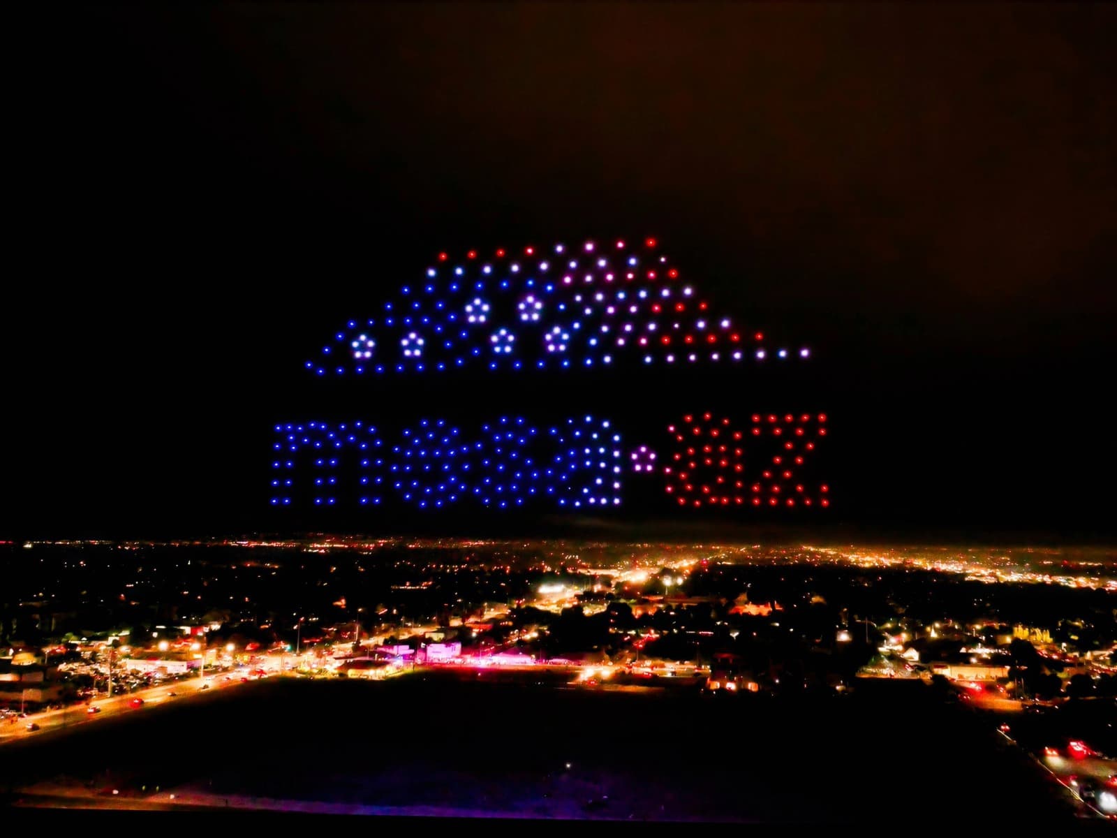 A drone light show formation at 300-drone scale